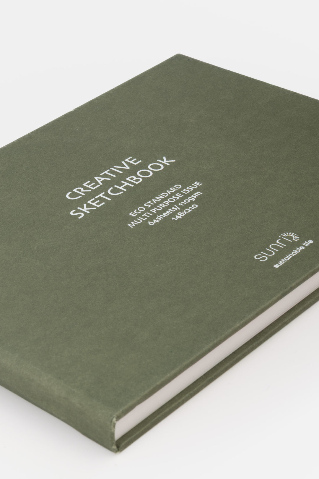 close up of the green sketchbook cover with white printed title