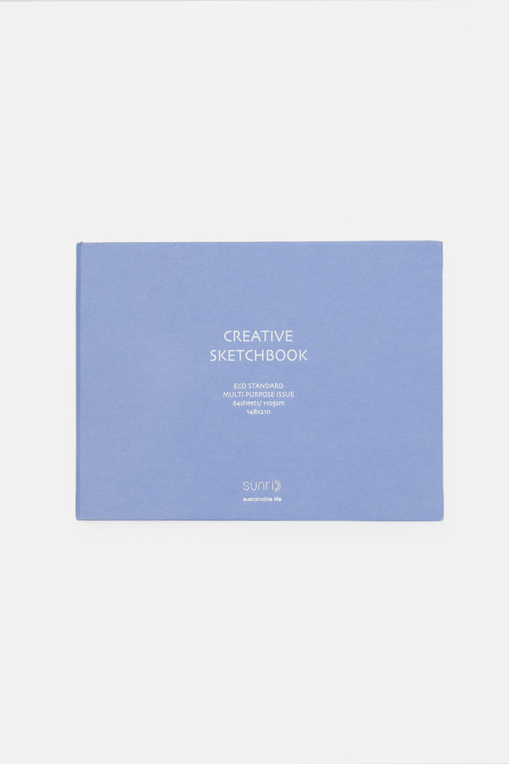 purple landscape sketchbook closed with white title on the cover