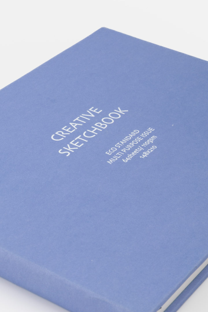 close up of the purple sketchbook cover with white printed title