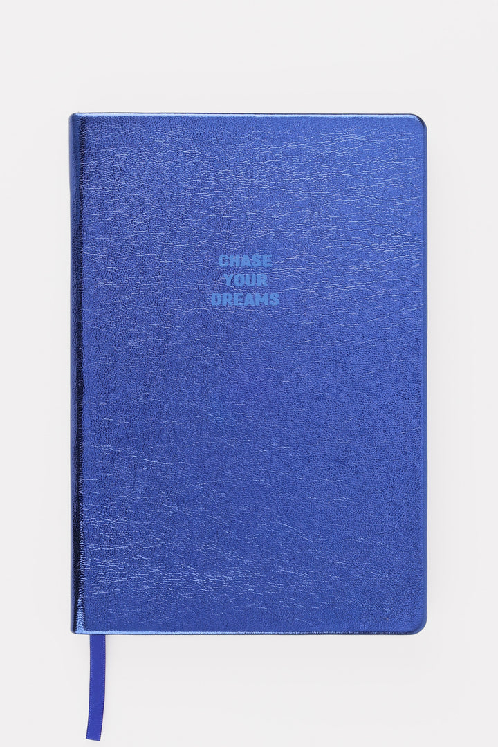Closed blue metallic A5 notebook with chase your dreams text on the cover
