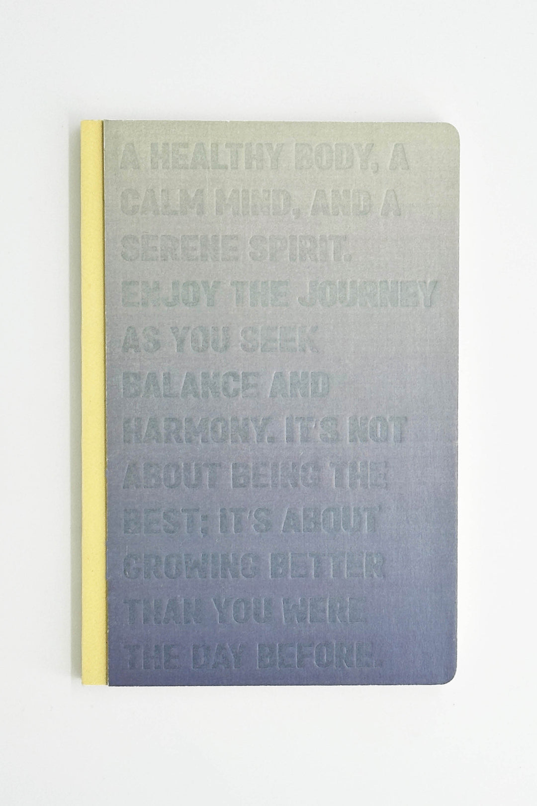 notebook with motivational text on a gradient cover