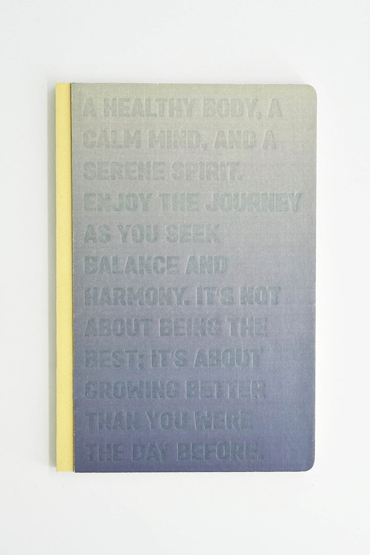 notebook with motivational text on a gradient cover
