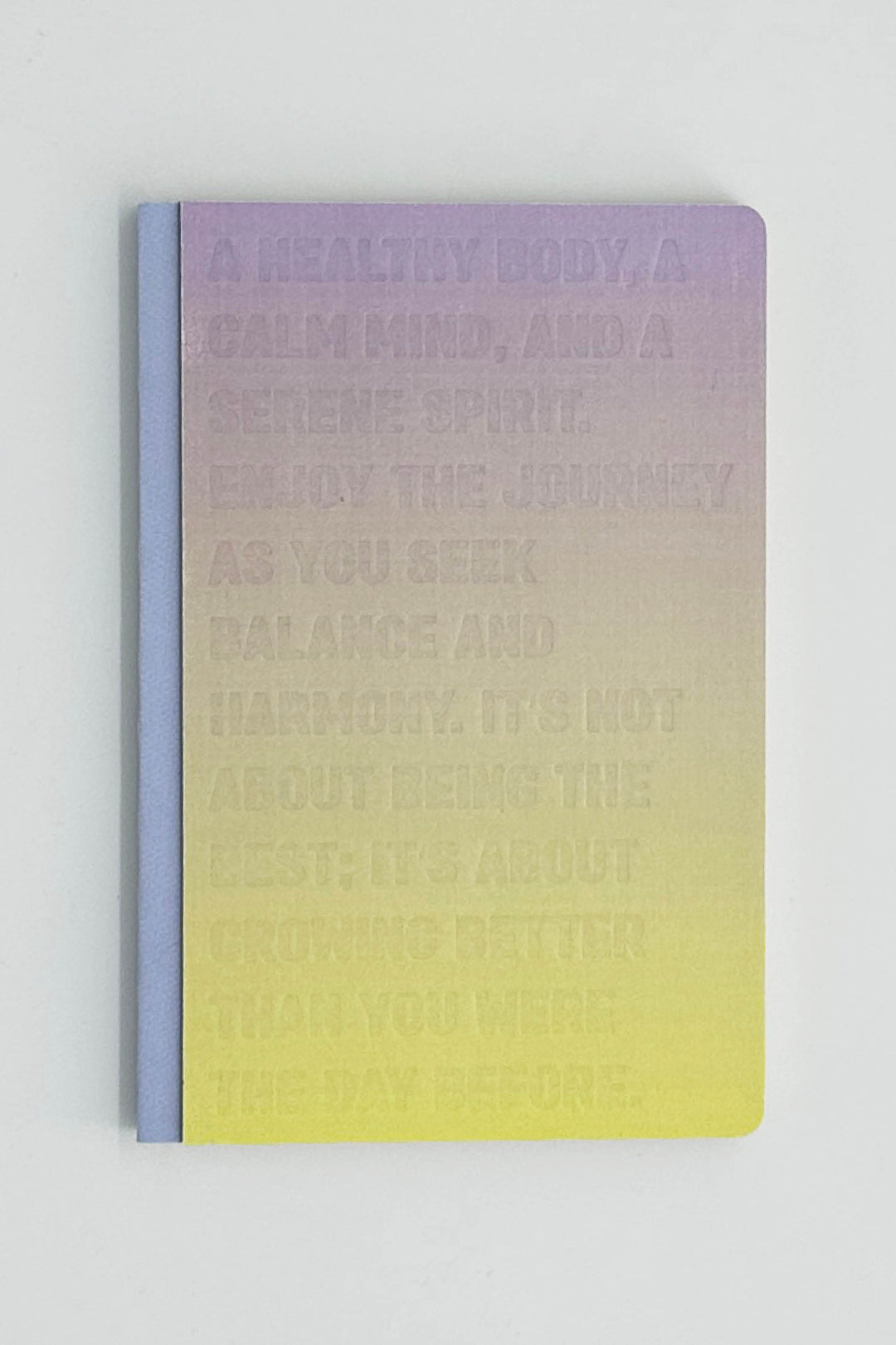 Gradient notebook with text on a light gray background