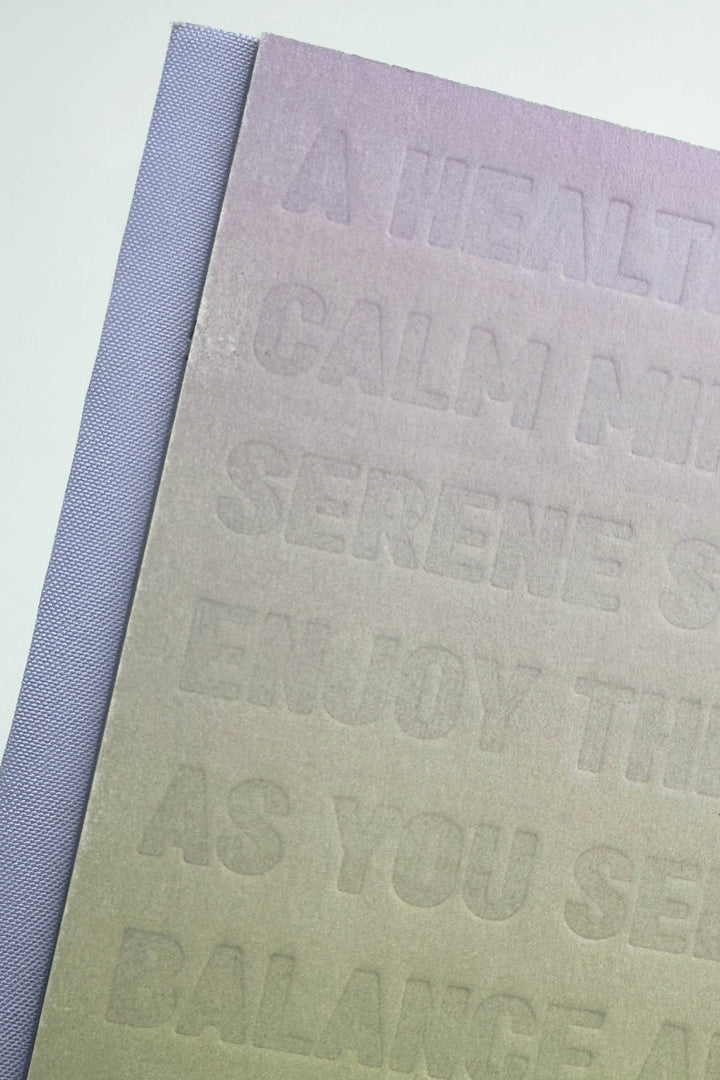 Textured notebook with embossed text on a light background