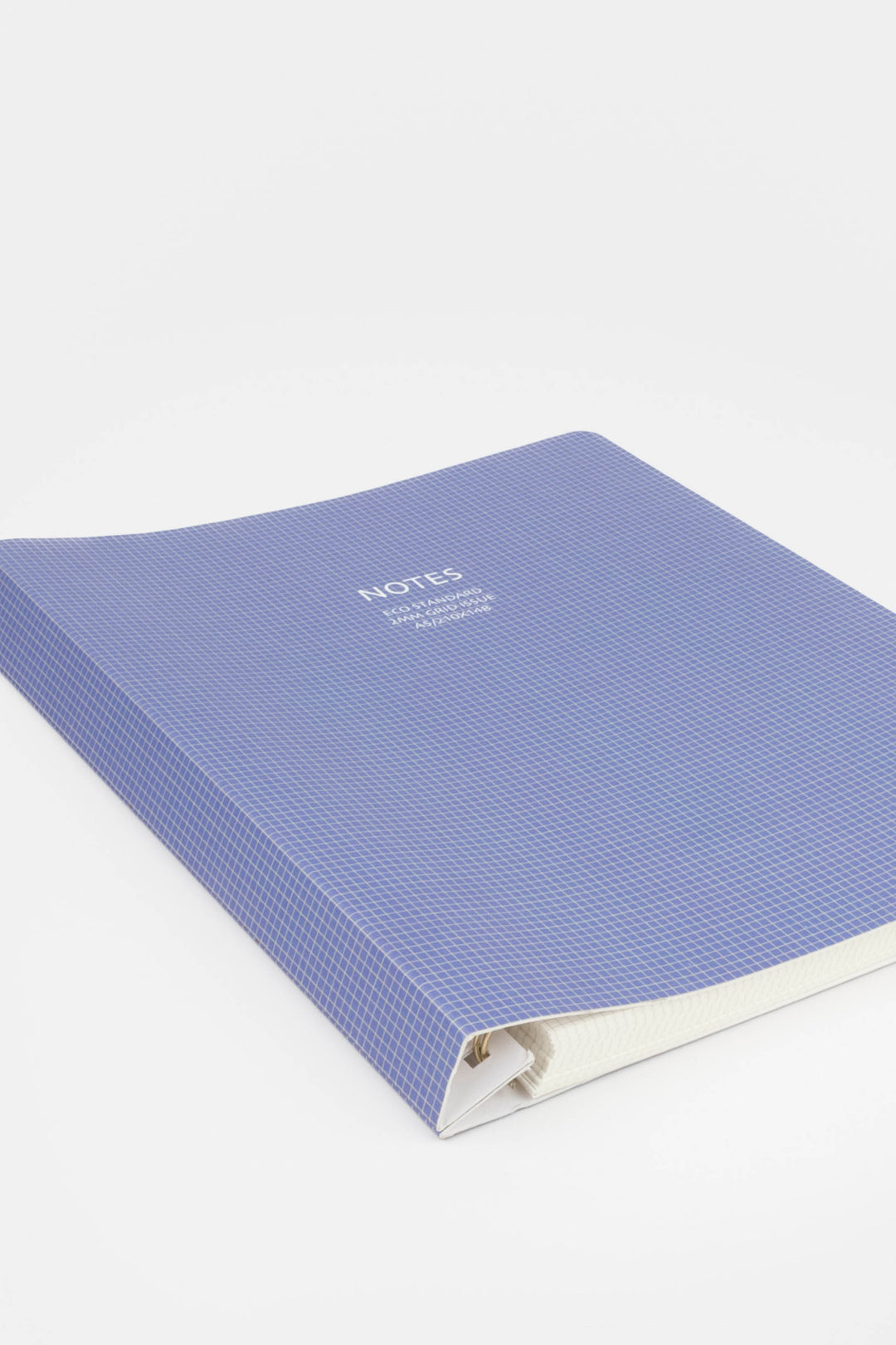 Blue notebook with a grid cover on a white background