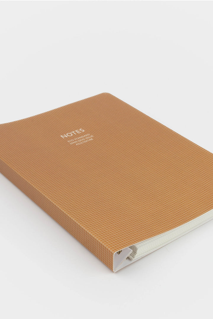 Brown notebook with 'Notes' text on a white background