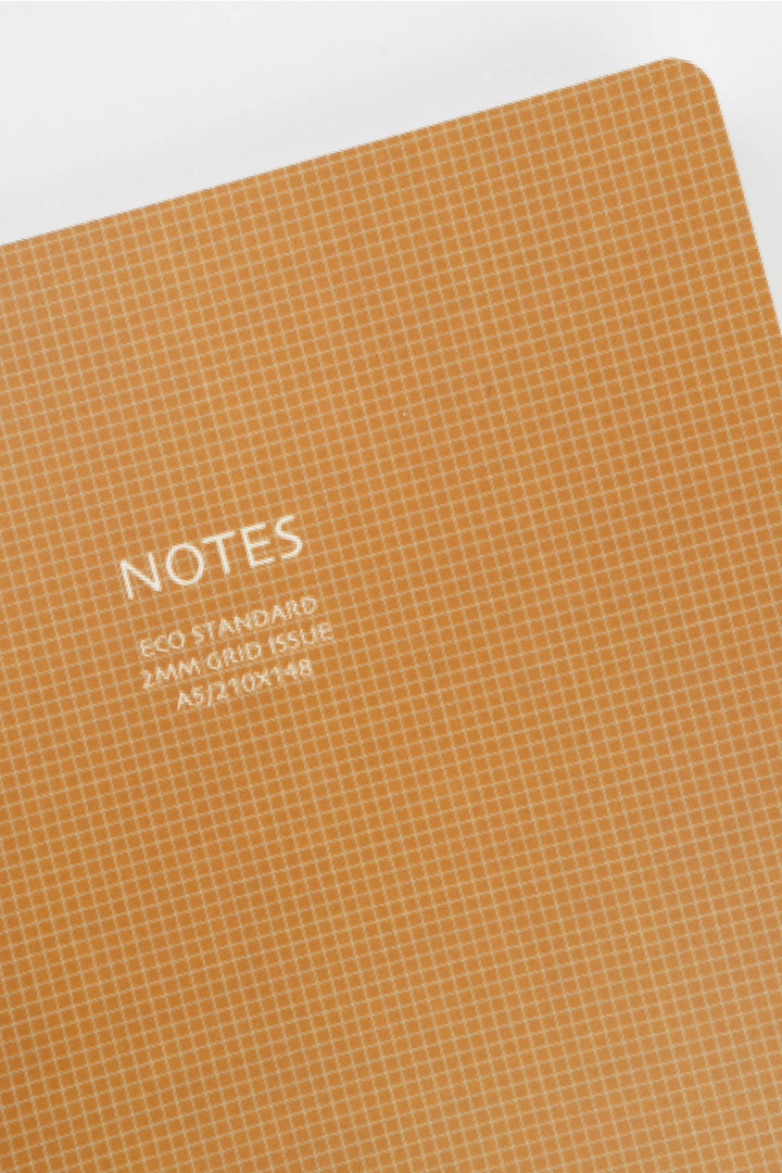 brownnotebook with grid pattern and 'NOTES' text on a white background