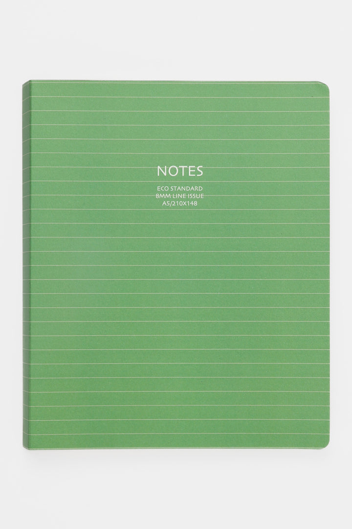 green A5 notebook with lined cover photographed front facing
