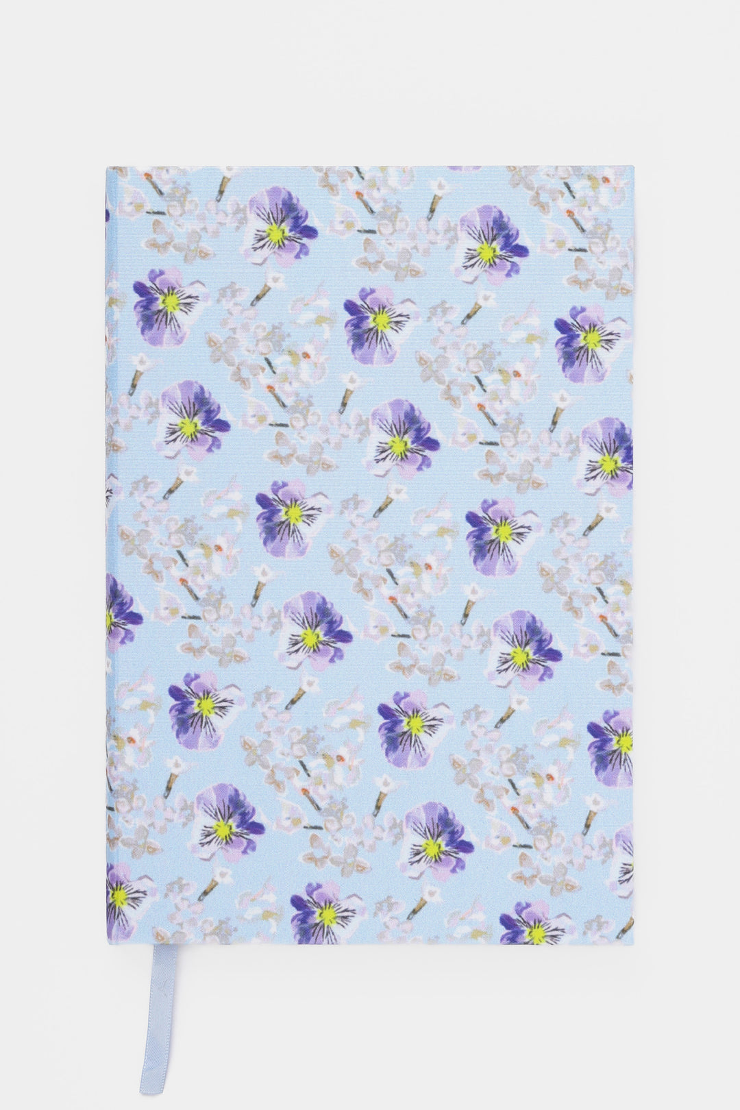 Notebook with floral pattern on a light blue background