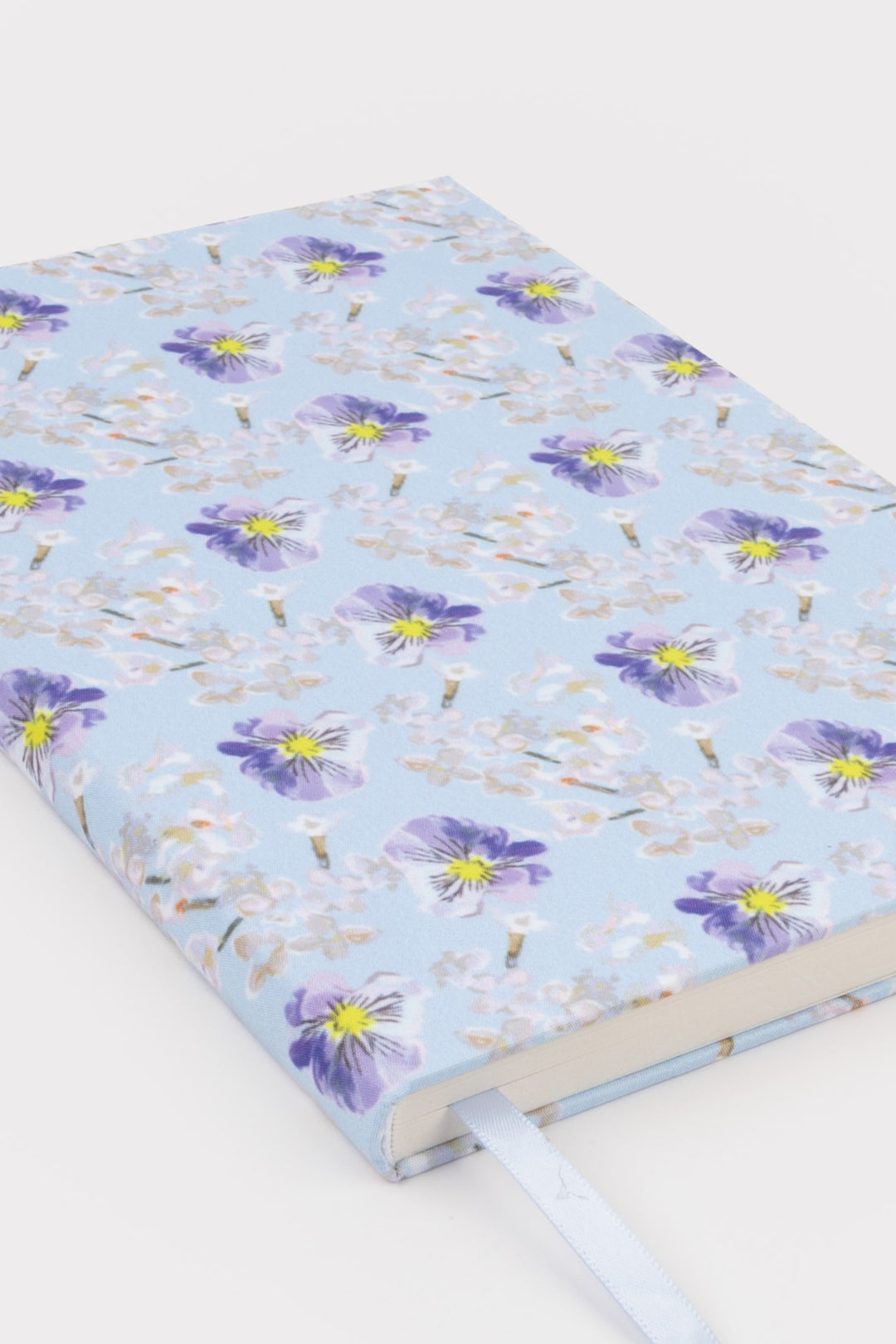 Floral-patterned notebook on a white background