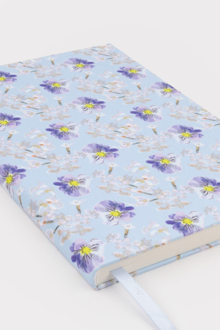 Floral-patterned notebook on a white background