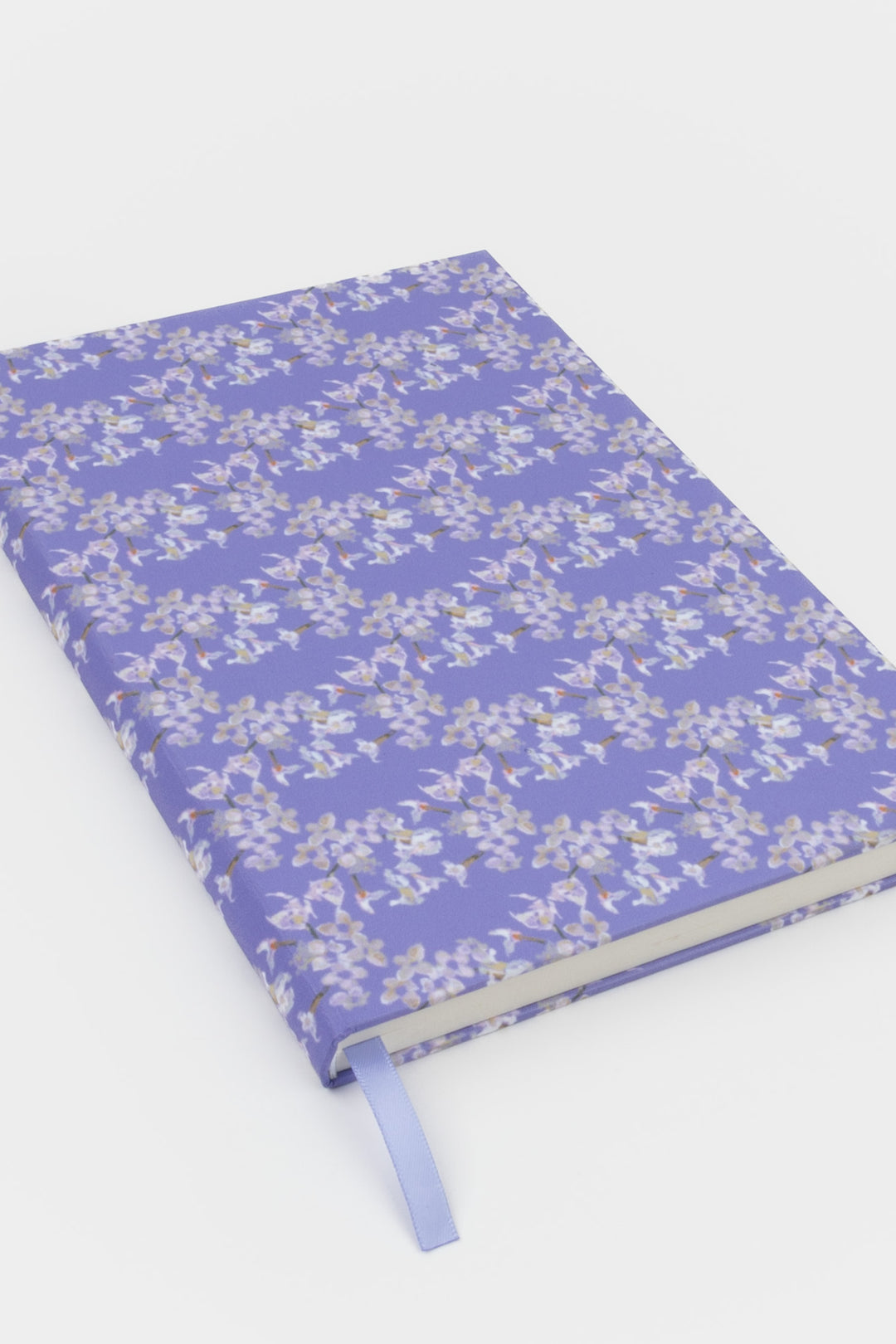 Floral-patterned notebook on a white background