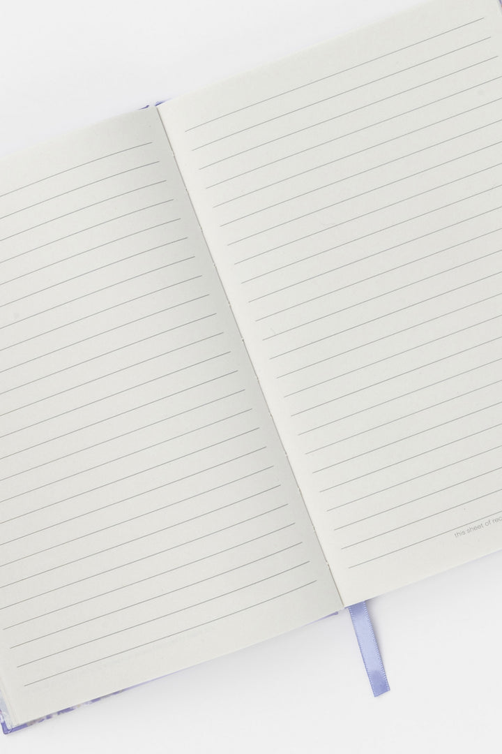 open notebook with lined pages on a white background