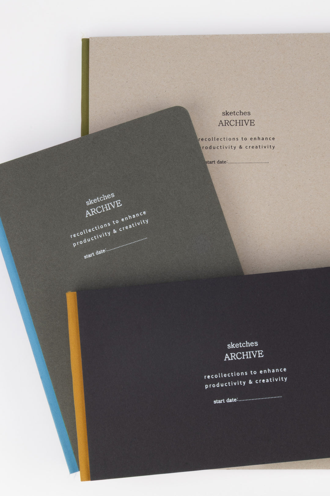 Three sketchbooks with 'sketches ARCHIVE' branding 
