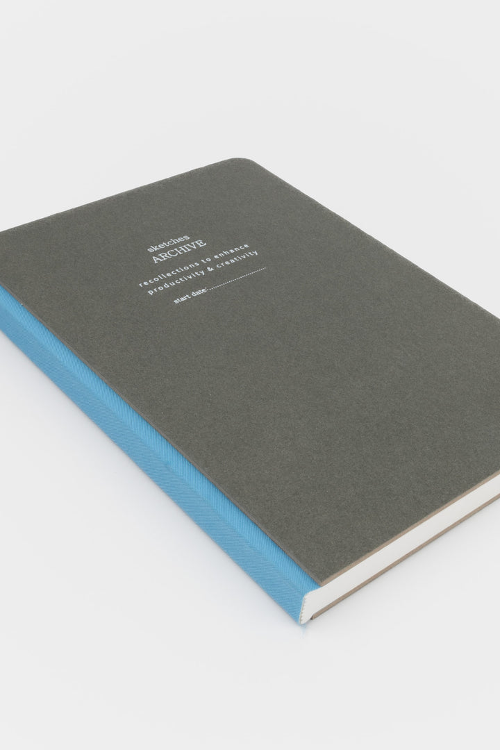 Grey sketchbook with blue binding 