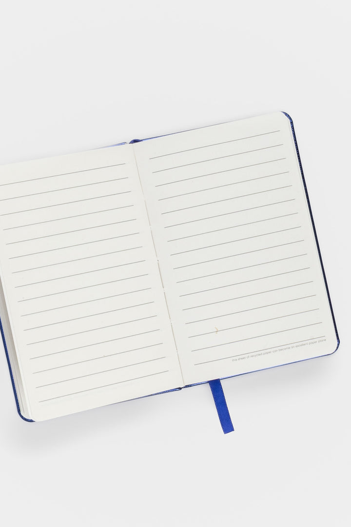 open a6 notebook with ruled recycled paper and blue ribbon marker