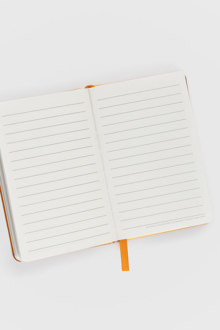 open a6 notebook with ruled recycled paper and blue ribbon marker