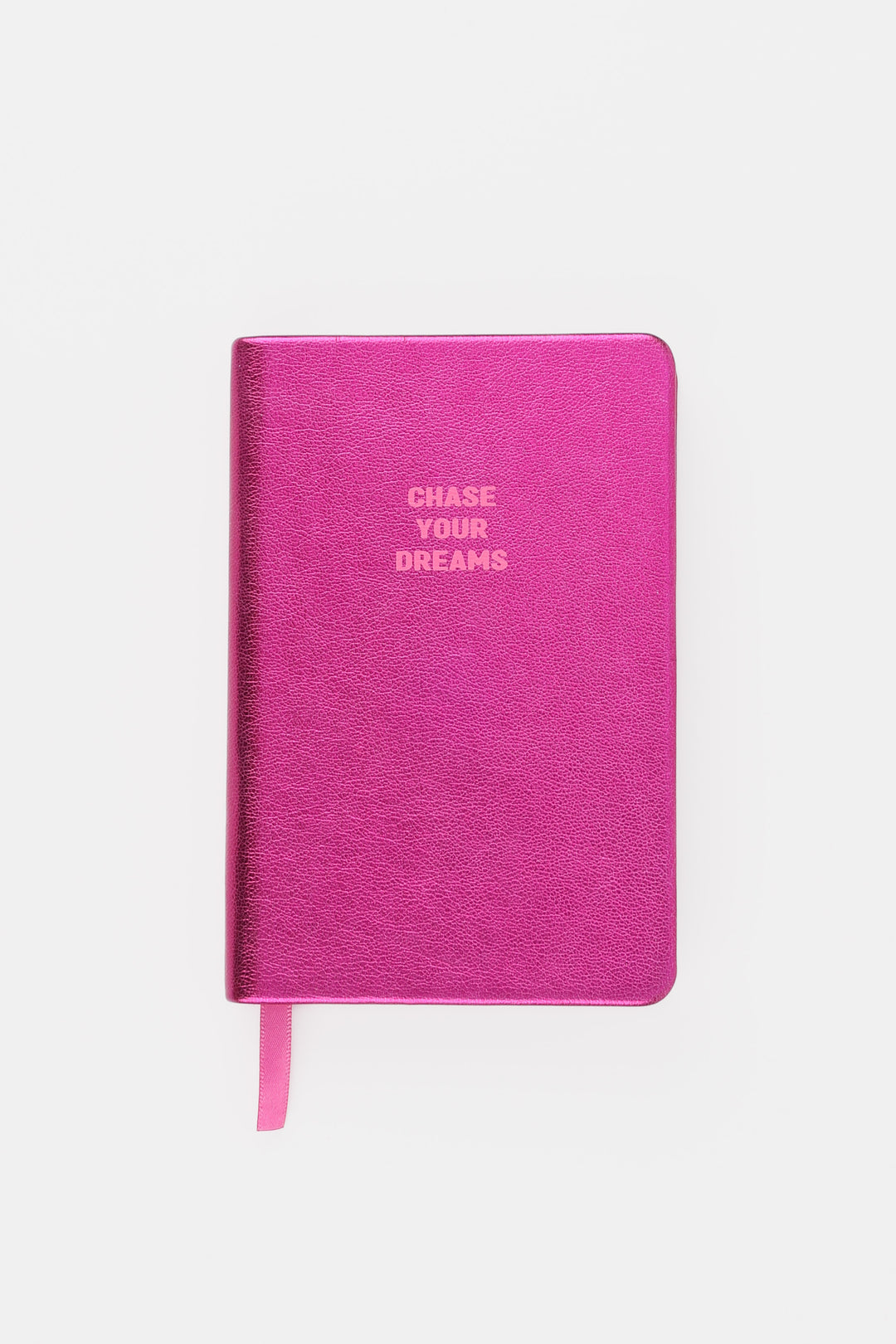 Closed pink metallic A6 notebook with chase your dreams text
