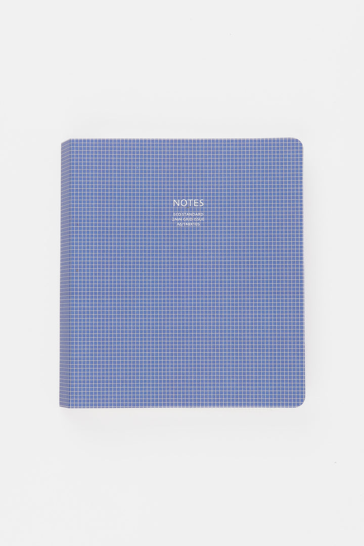 Blue checkered notebook with 'NOTES' text on a white background