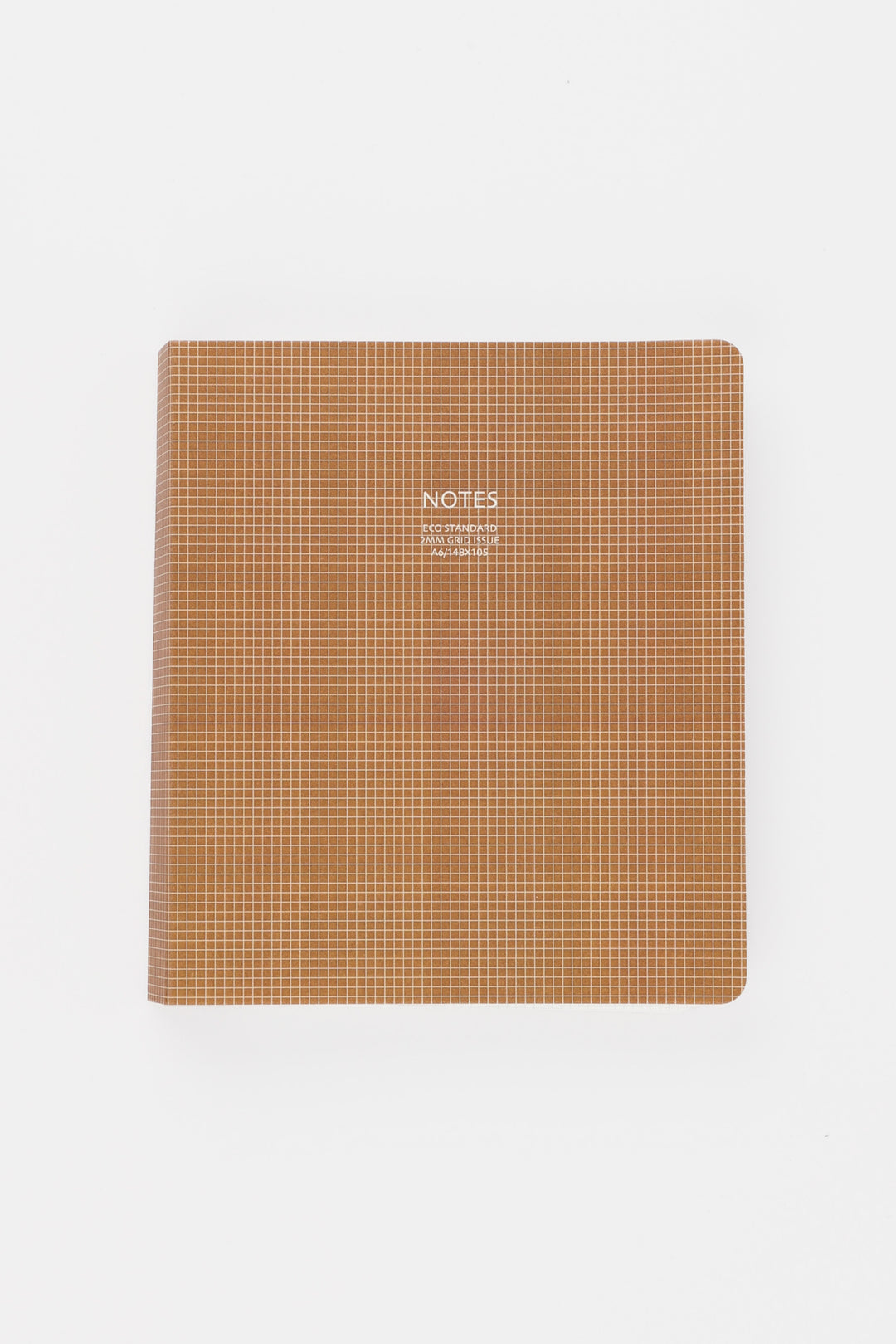 Brown notebook with grid pattern on a white background