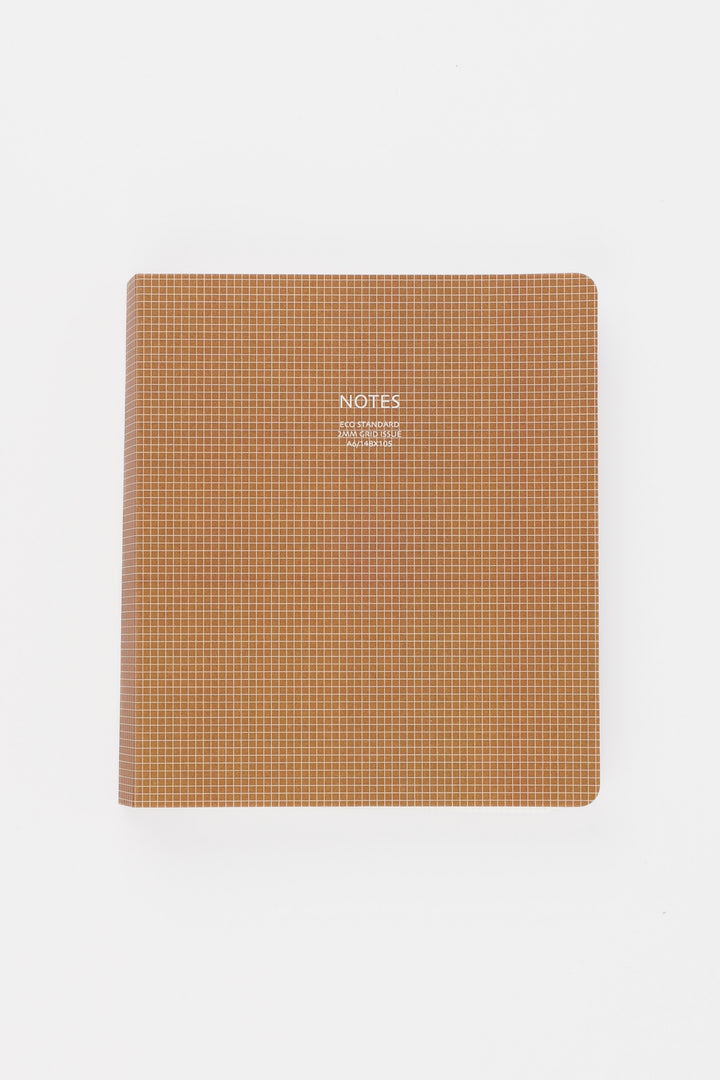 Brown notebook with grid pattern on a white background