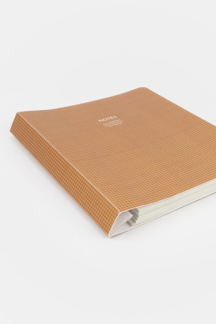 Brown textured notebook on a white background
