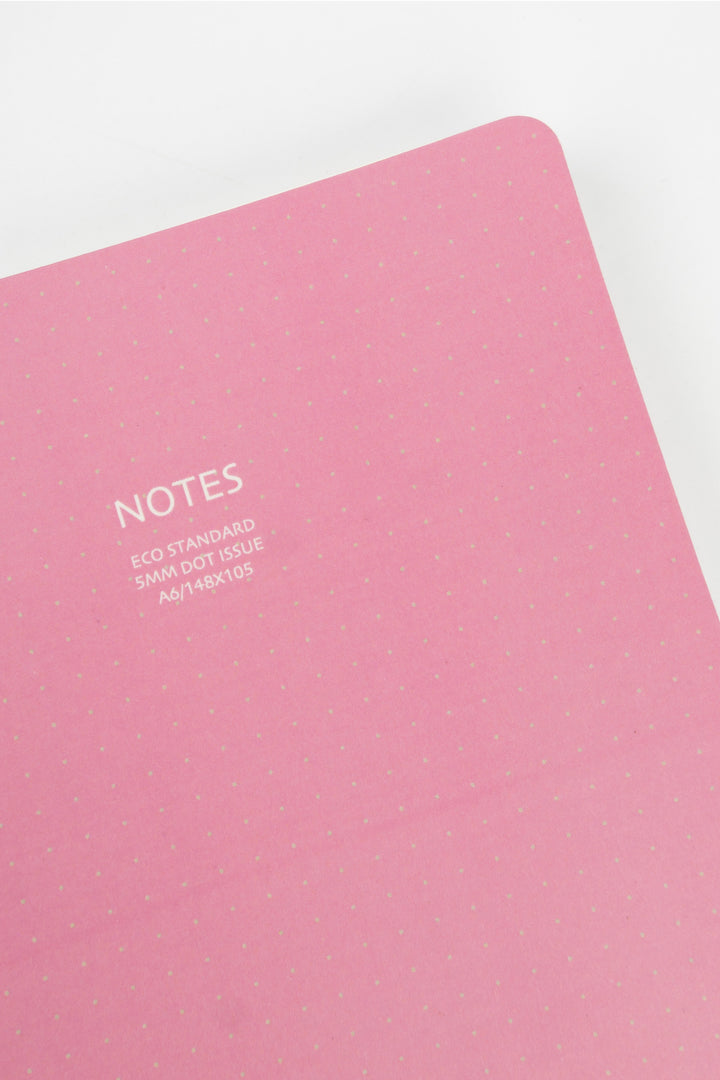 Pink notebook with 'NOTES' text on a white background
