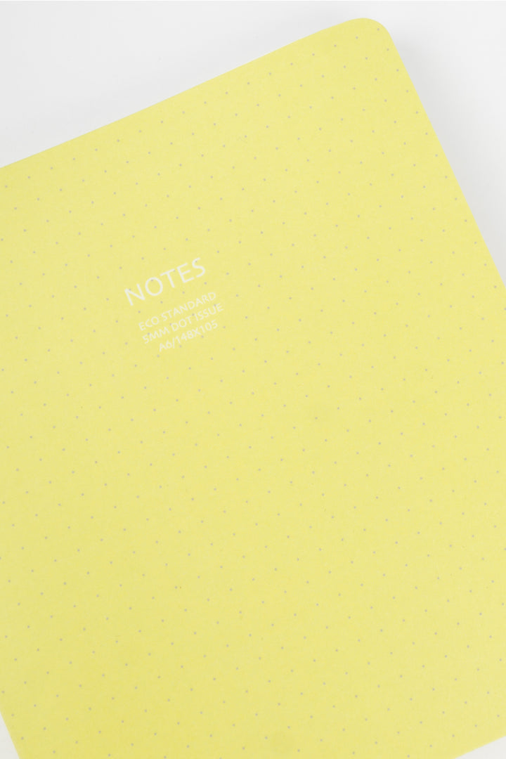 Yellow notebook with 'NOTES' text on a white background