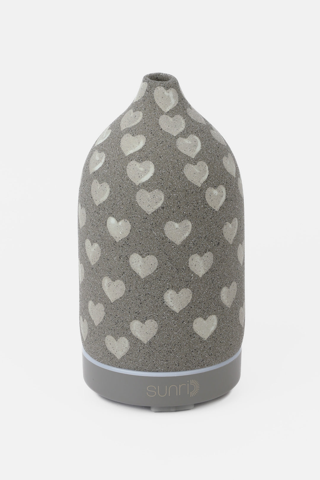 Grey diffuser with heart pattern on a white background