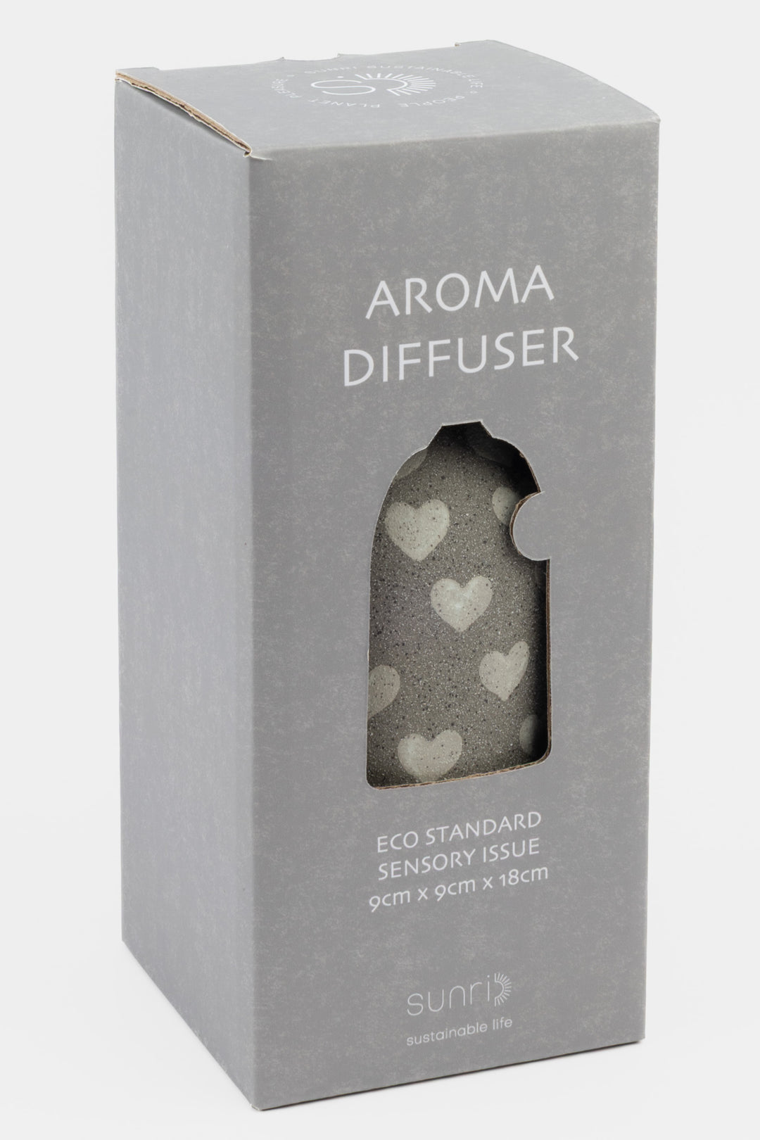 Aroma diffuser packaging with heart designs on a gray background