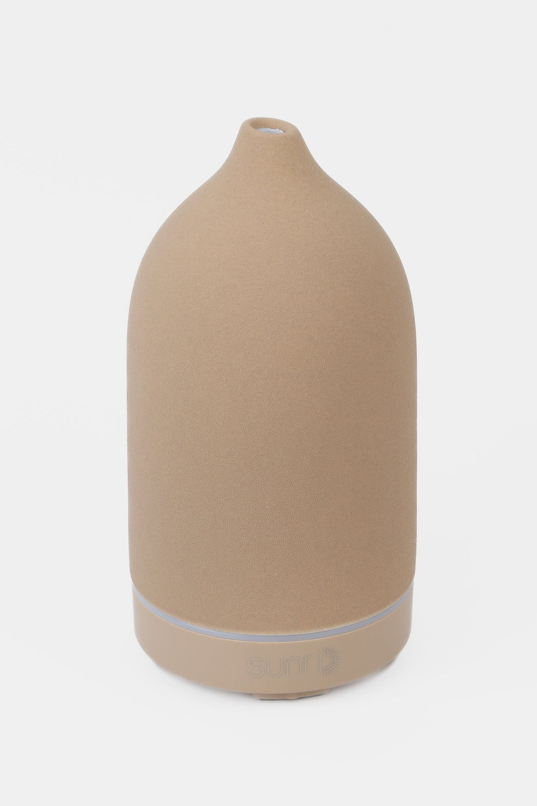 Beige essential oil diffuser on a white background