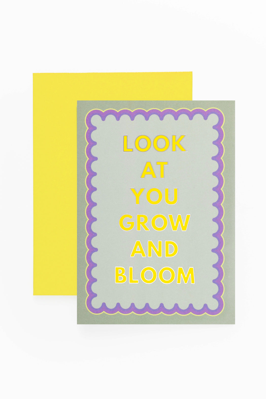 greeting card look at you grow and bloom placed on bright yellow envelope
