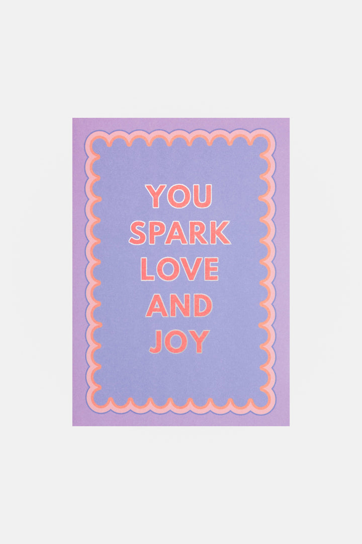 Motivational greeting card with 'You Spark Love and Joy' text on a purple background
