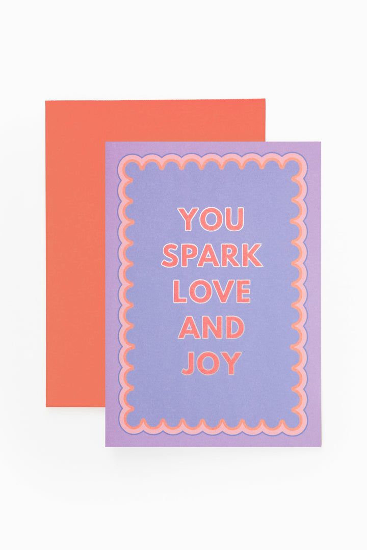 Purple card with 'You Spark Love and Joy' text on a white background