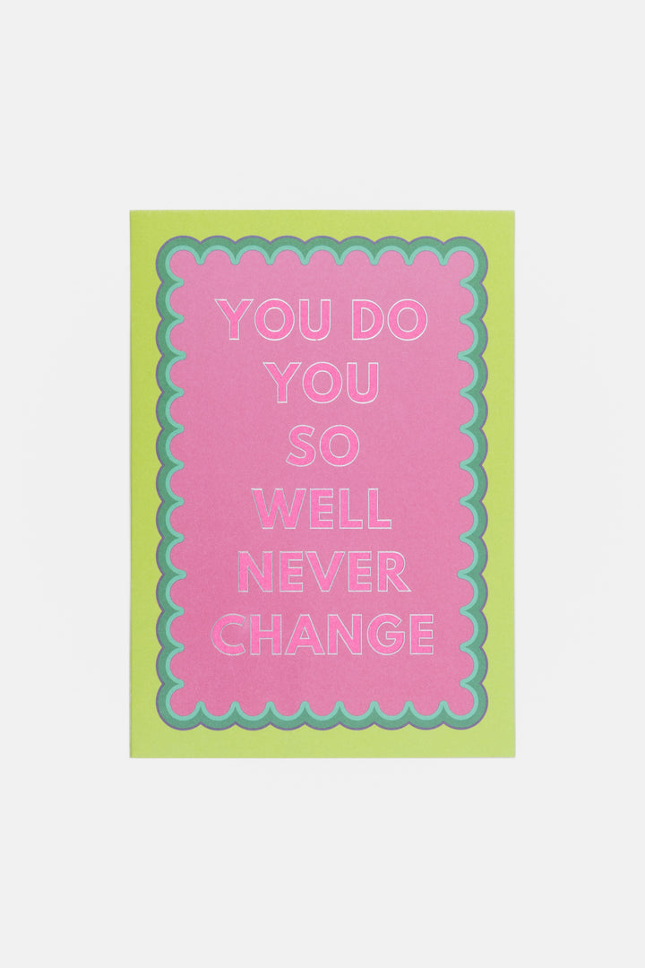 Motivational card with text 'You do you so well never change' on a pink and green background