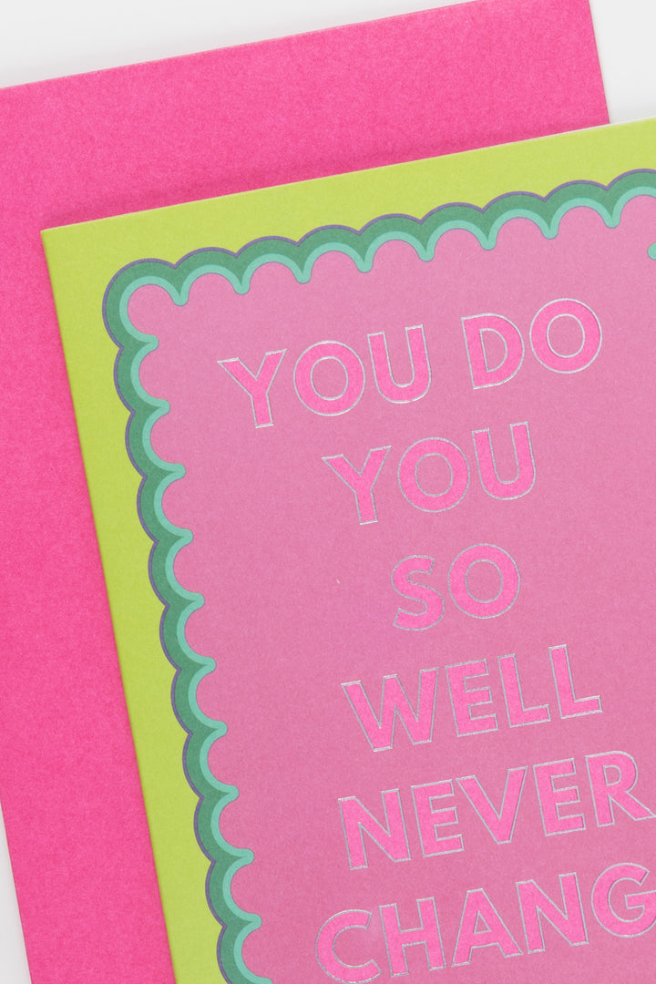 Pink card with green border and text 'YOU DO YOU SO WELL NEVER CHANGE' on a white background