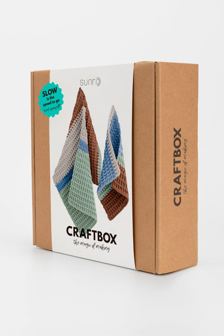 CraftBox packaging with crochet items on a white background