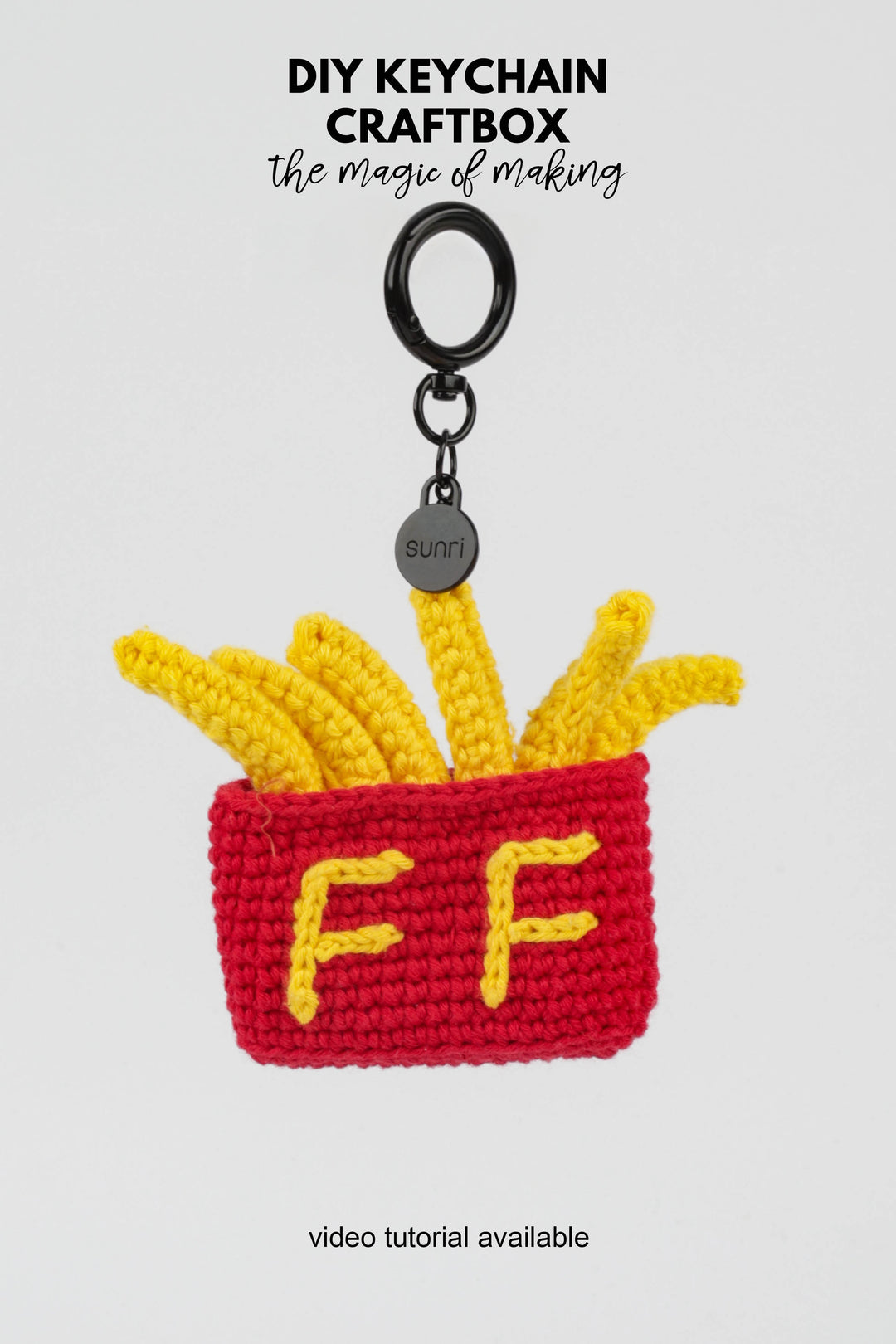 Crocheted keychain with French fries design on a white background