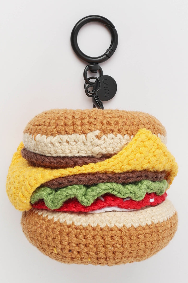 Crocheted hamburger keychain on a white background