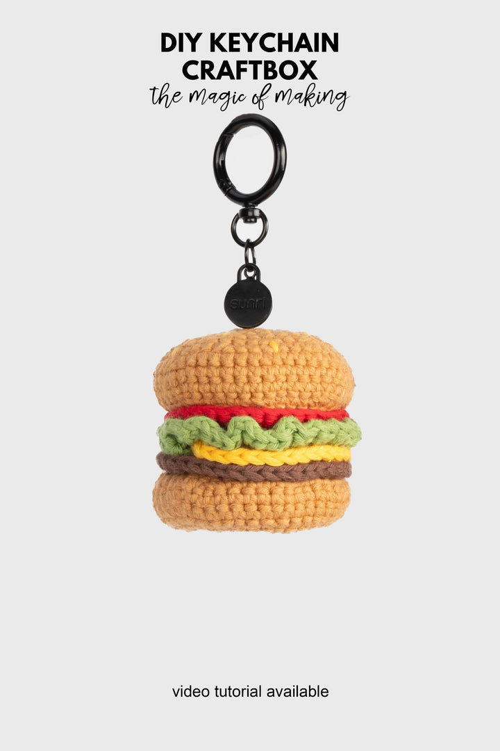 Crocheted hamburger keychain on a white background with 'DIY Keychain Craftbox' text.