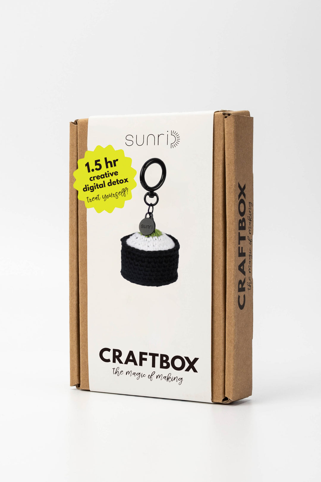 Craft box packaging with a keychain and branding on a white background