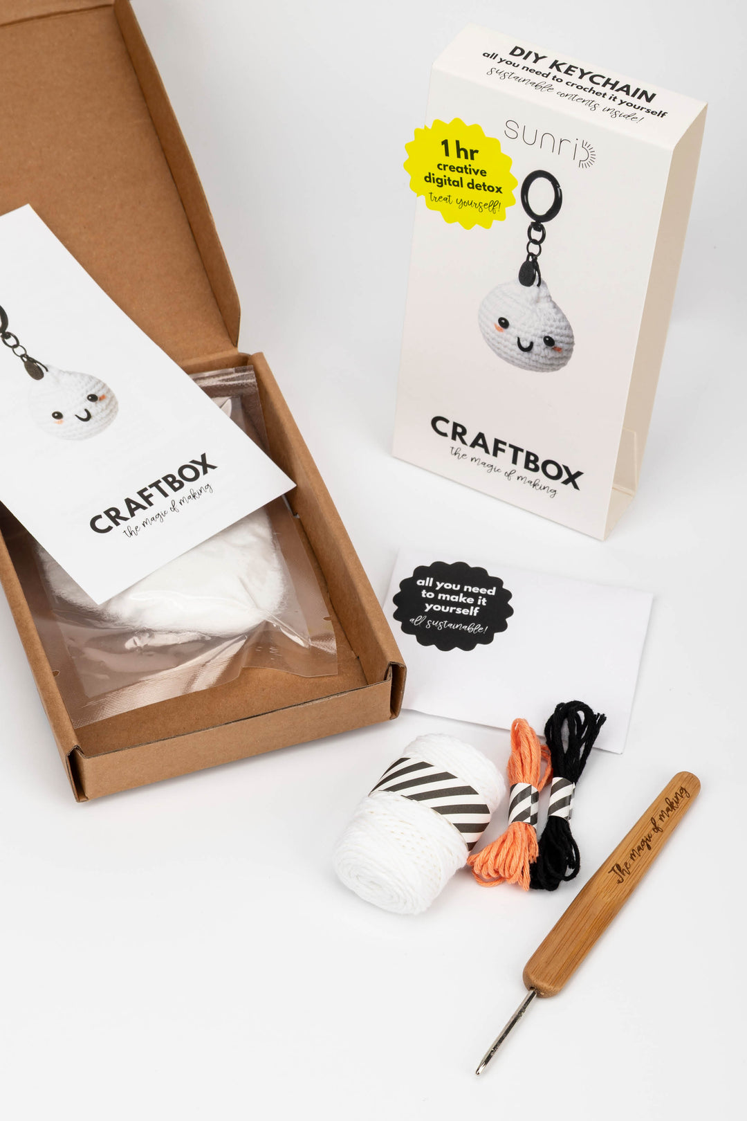 Craftbox DIY keychain kit with materials and tools on a white background