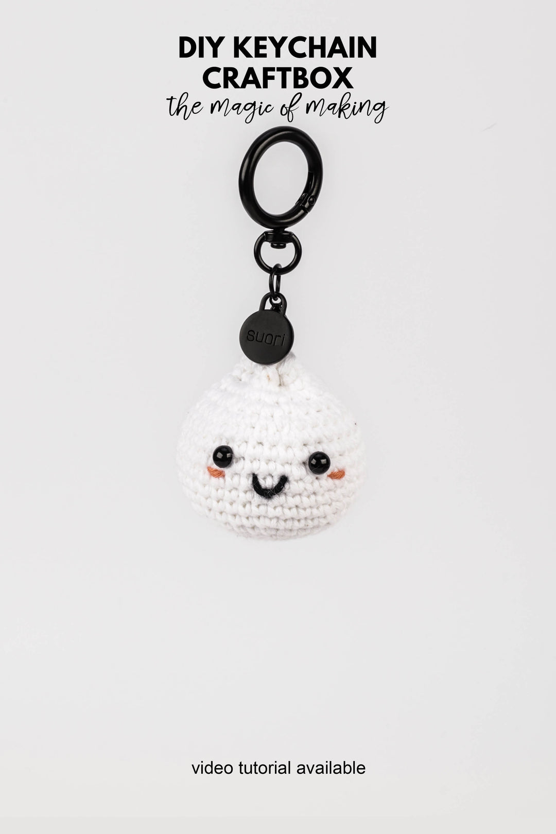 White sushi crochet keychain with black accents on a white background, featuring text about DIY keychain craftbox.