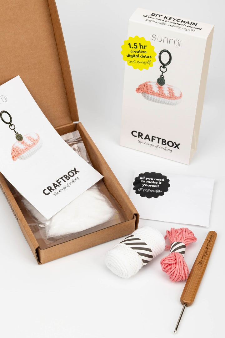 Craftbox DIY keychain kit with materials and tools on a white background