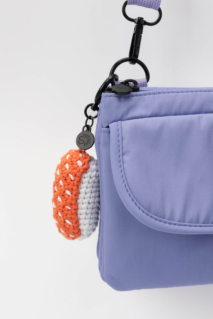 Purple pouch with a keychain on a white background