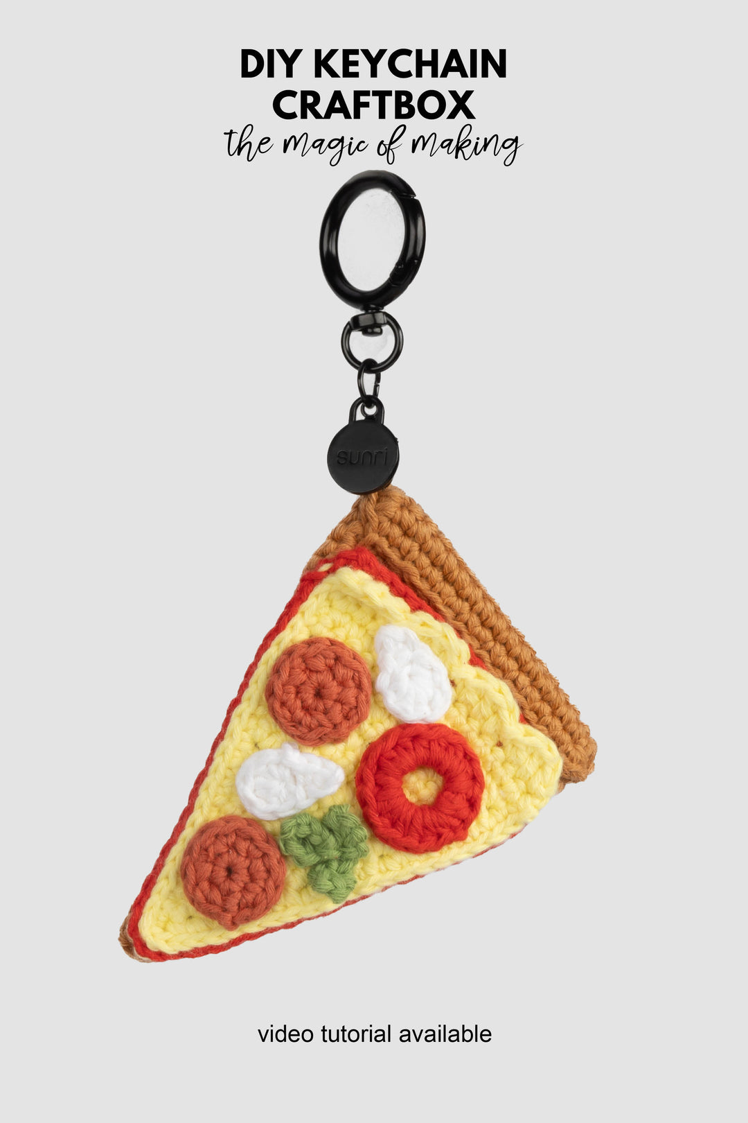 Crocheted pizza keychain with a black clip on a white background, featuring 'DIY Keychain Craftbox' text.