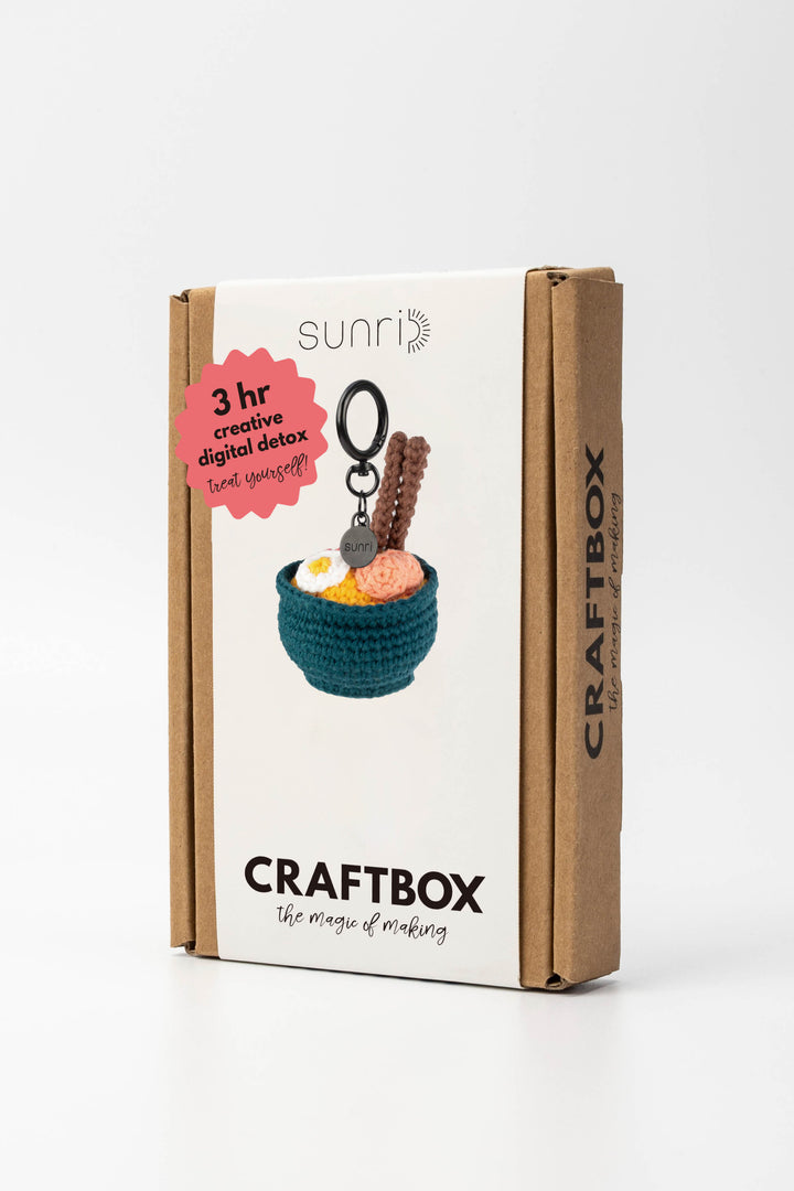 Craft box packaging with keychain and bowl on a white background