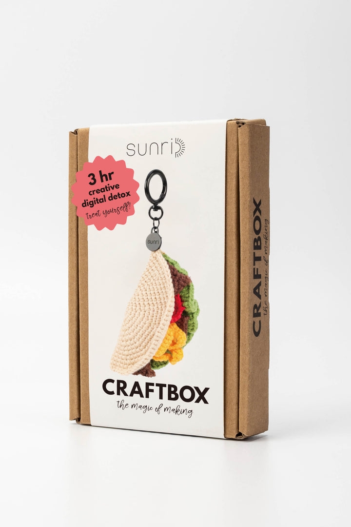 Craft box packaging with a keychain and branding on a white background