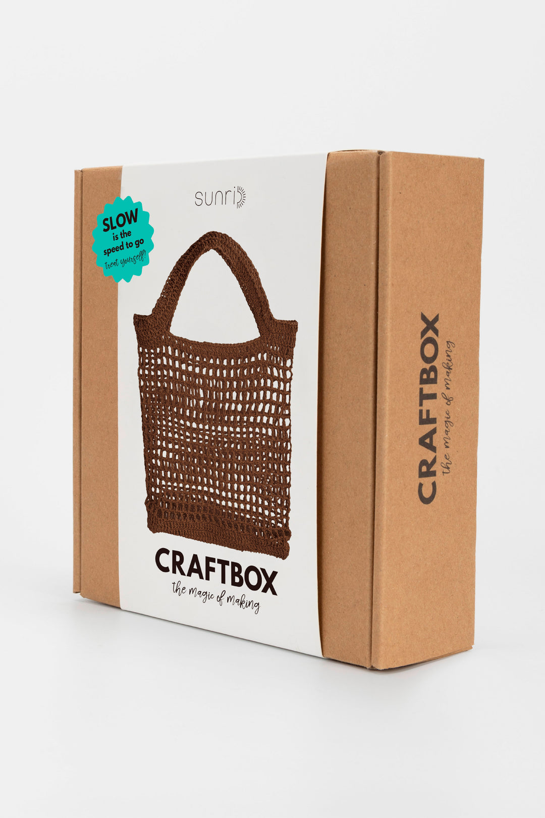 Craftbox packaging with a brown crochet bag on a white background
