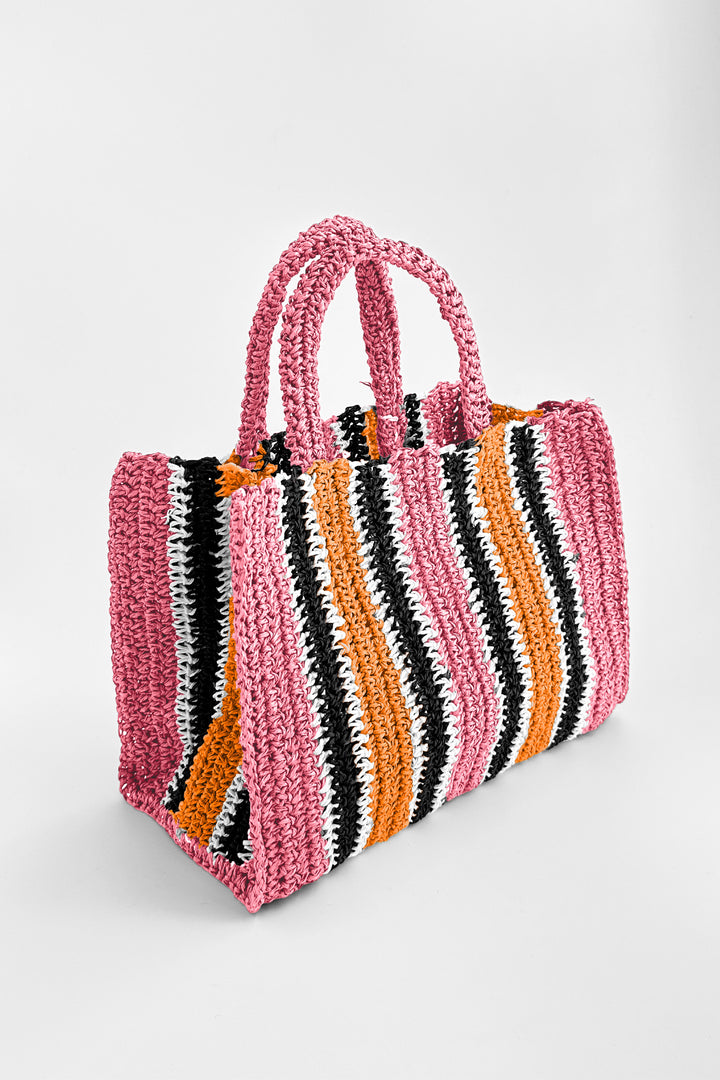 Multicolored striped bag on a light gray background